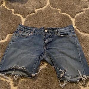 7 For All Man Kind jeans cut into shorts